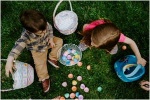 Two children playing in the garden.